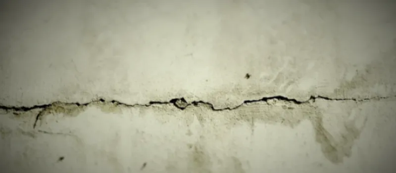Cracks on flooring showing Dallas foundation repair needs.
